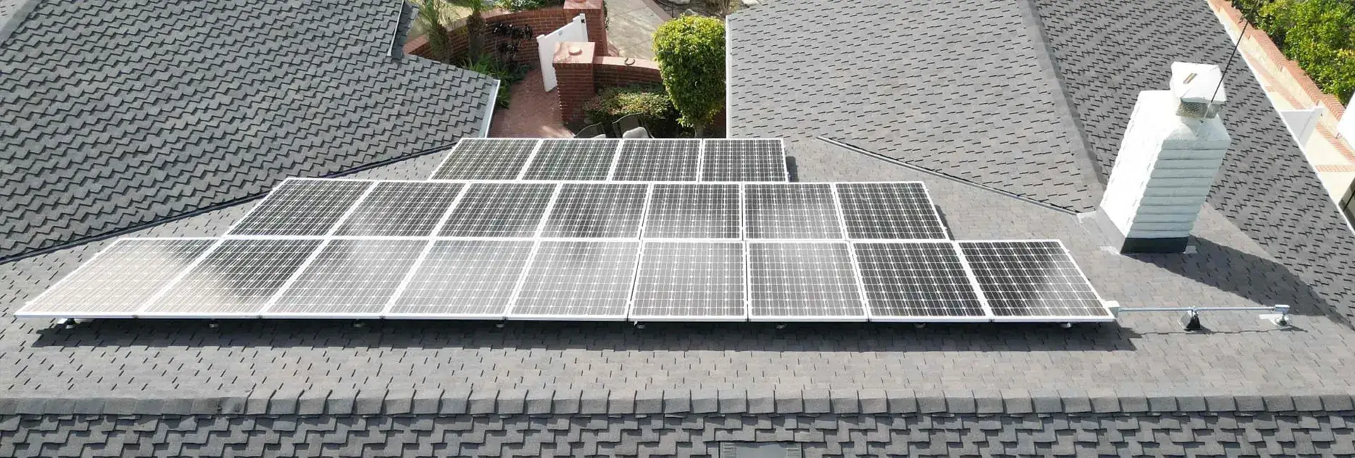 Asphalt shingle roof with solar panels