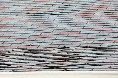 How to Prevent Roof Leaks by Replacing Damaged or Curled Shingles