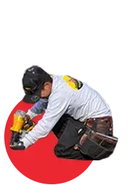LocalRoofs roofer with nail gun, fastening an asphalt shingle
